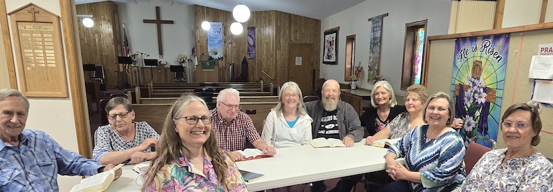 Bible Study group of people sitting around the table at The Lighthouse Christian Church