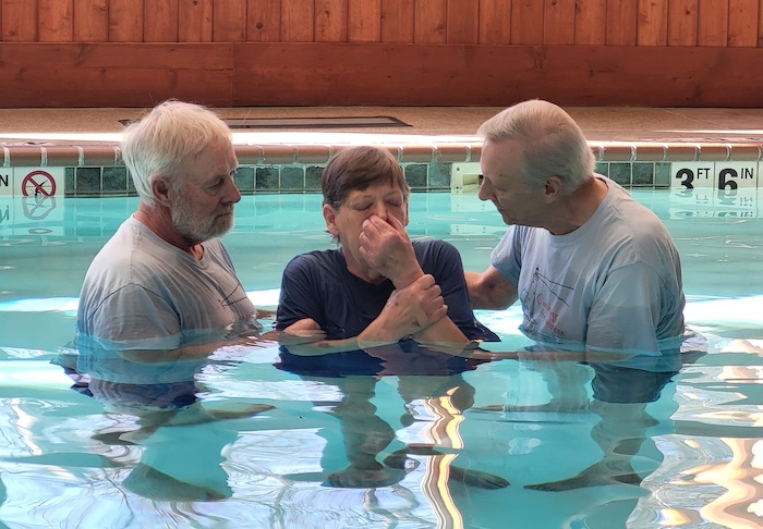 Baptism in swimming pool with pastor