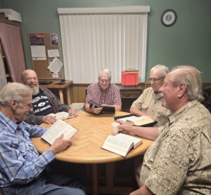 Men of Faith Bible Study group sitting at the table with their bibles